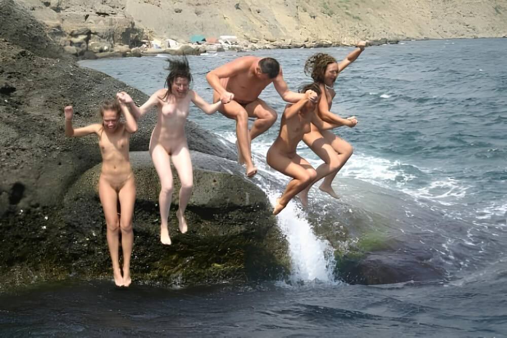 Mens and girls nudists on a beach - Nudity is an expression of natural beauty