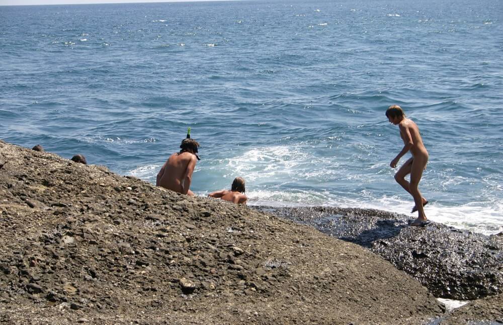 Leaning Against Hit Rocks pics - Nudism helps overcome insecurities